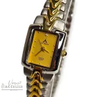 ASTRON 5072-9 női karóra, ezüst színű fém tok, bicolor fémcsat, sárga számlap, keményített ásványüveg, quartz szerkezet, cseppmentes vízállóság