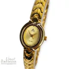 ASTRON 5085-9 női karóra, arany színű nemesacél tok, arany színű fémcsat, arany színű számlap, keményített ásványüveg, quartz szerkezet, cseppmentes vízállóság