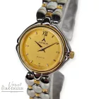 ASTRON 5115-9 női karóra, bicolor színű nemesacél tok, bicolor nemesacél csat, arany színű számlap, keményített ásványüveg, svájci szerkezet, quartz szerkezet, cseppmentes vízállóság