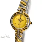 ASTRON 5175-9 női karóra, bicolor színű nemesacél tok, bicolor nemesacél csat, arany színű számlap, keményített ásványüveg, svájci szerkezet, quartz szerkezet, cseppmentes vízállóság