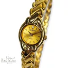 ASTRON 5182-9 női karóra, arany színű fém tok, arany színű fémcsat, arany színű számlap, keményített ásványüveg, svájci szerkezet, quartz szerkezet, cseppmentes vízállóság