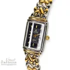 ASTRON 5255-9 női karóra, bicolor fém tok, bicolor fémcsat, fekete színű számlap, keményített ásványüveg, quartz szerkezet, cseppmentes vízállóság, dátum kijelzés