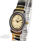 ASTRON 5445-9 női karóra, bicolor fém tok, bicolor gumis fémcsat, arany színű számlap, keményített ásványüveg, quartz szerkezet, cseppmentes vízállóság, dátum kijelzés